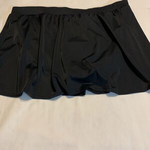 Size 26W one piece black swim skirt with built in panty. NEW